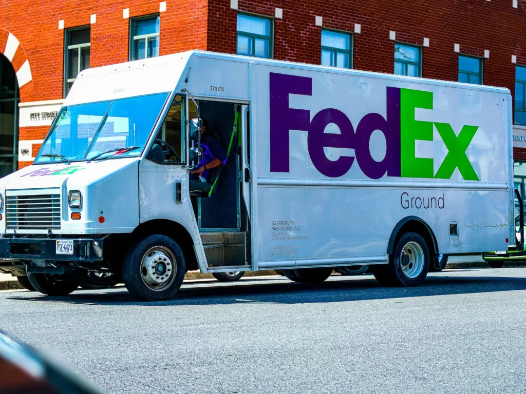 fedex van delivering packages