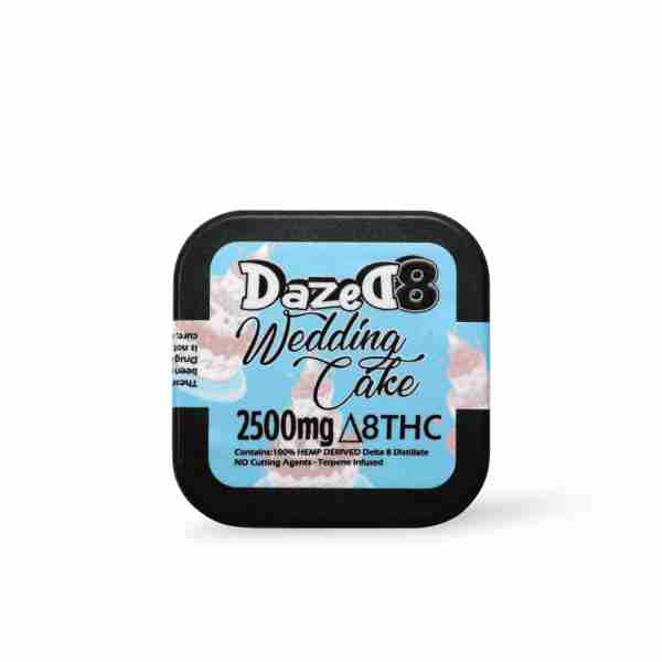 a tin of dazed wedding cake on a white background.