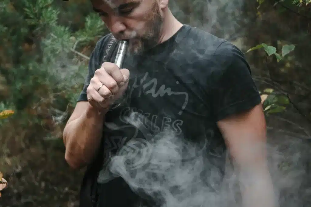 A man vaping out in the open