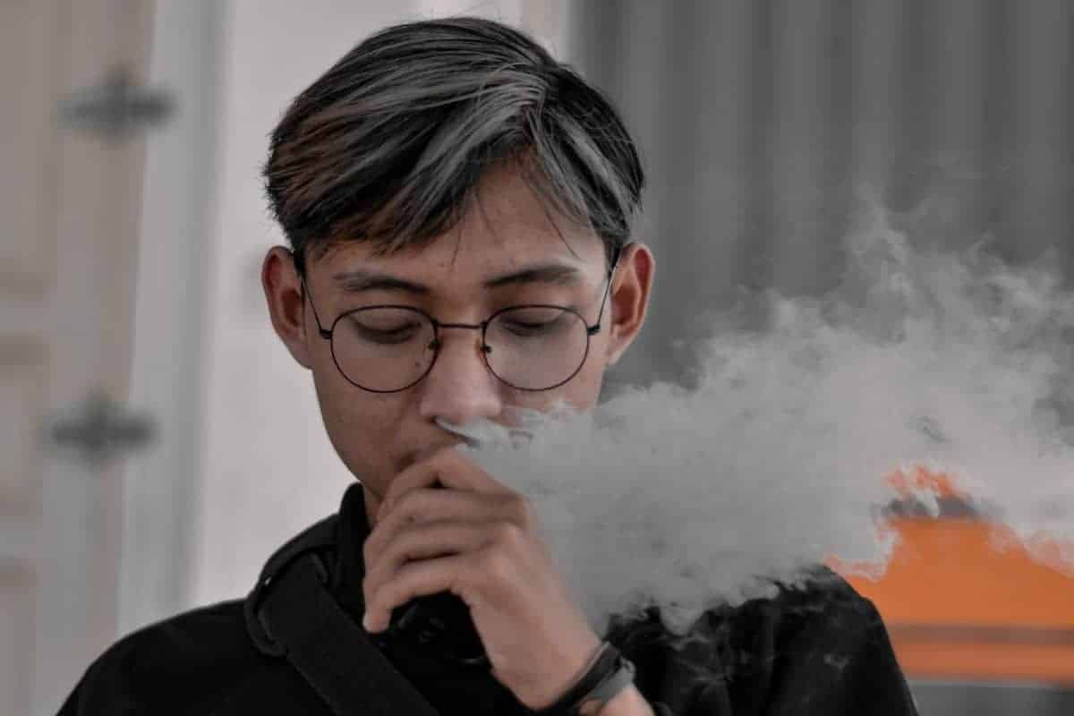 A young guy vaping