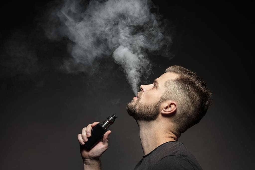 A guy vaping and avoid smoke alarms