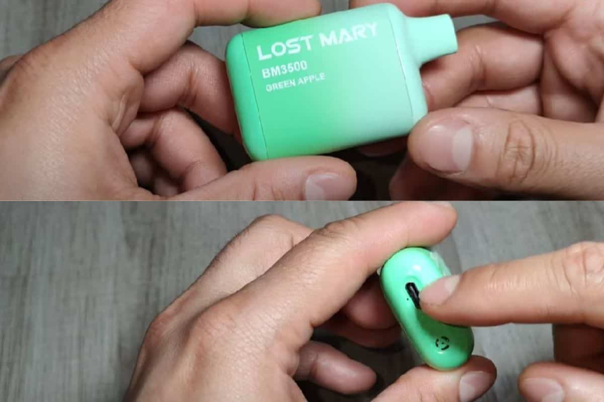 A man showing where is the charging port of Lost mary vape device