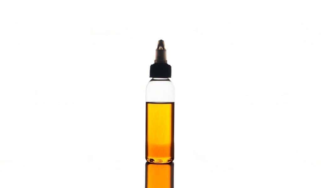 Orange flavor e-juice in the bottle