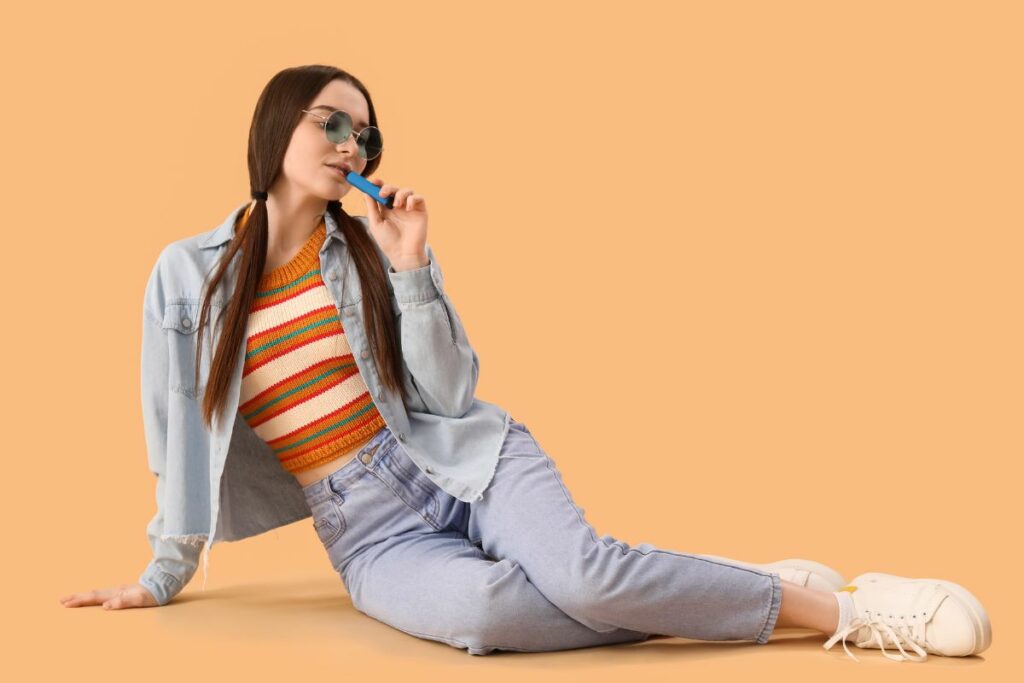 A well dressed lady vaping and having fun