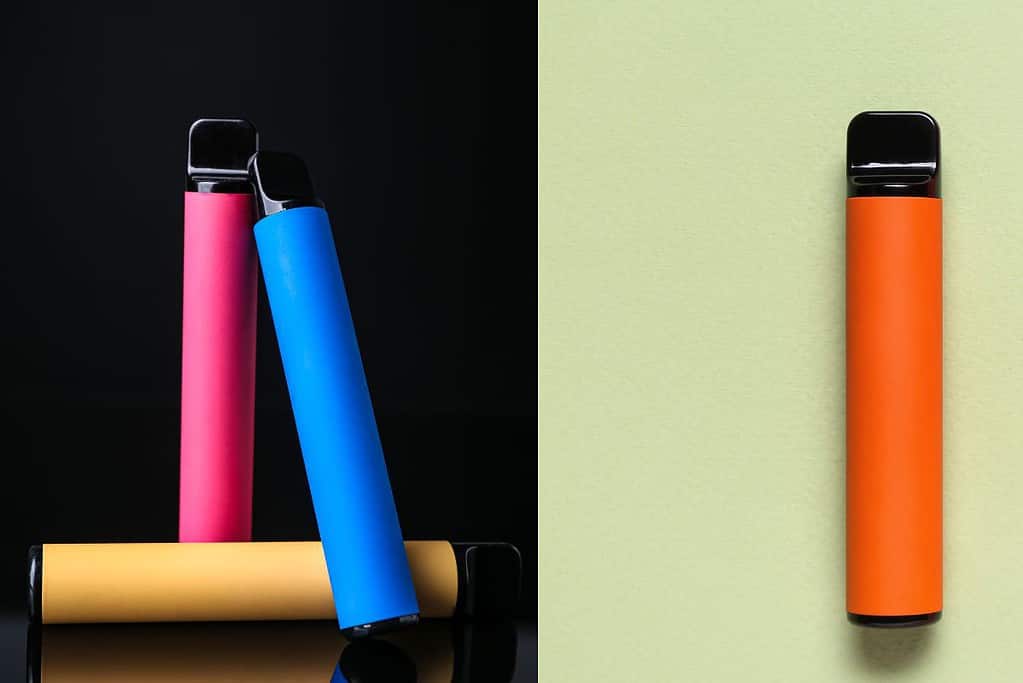 Three different colored e cigarettes on a black background, demonstrating how to know when elf bar is empty.