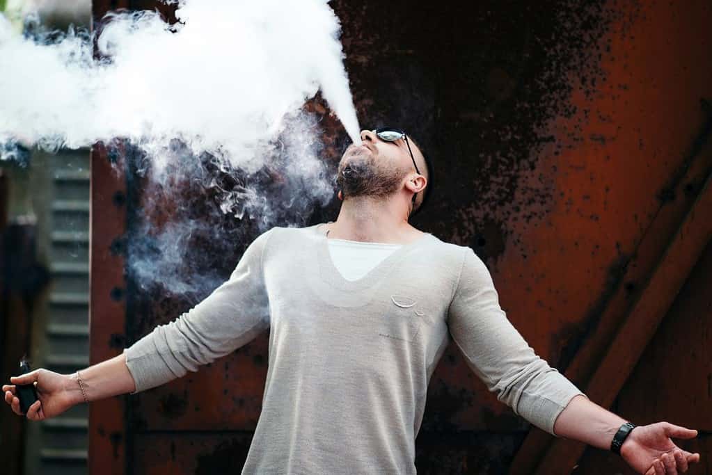 A guy enjoying his first vaping experience