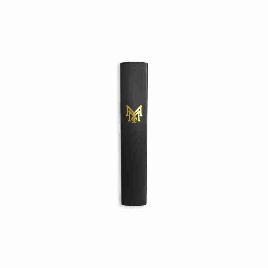 A black and gold vape pen with the letter m on it
