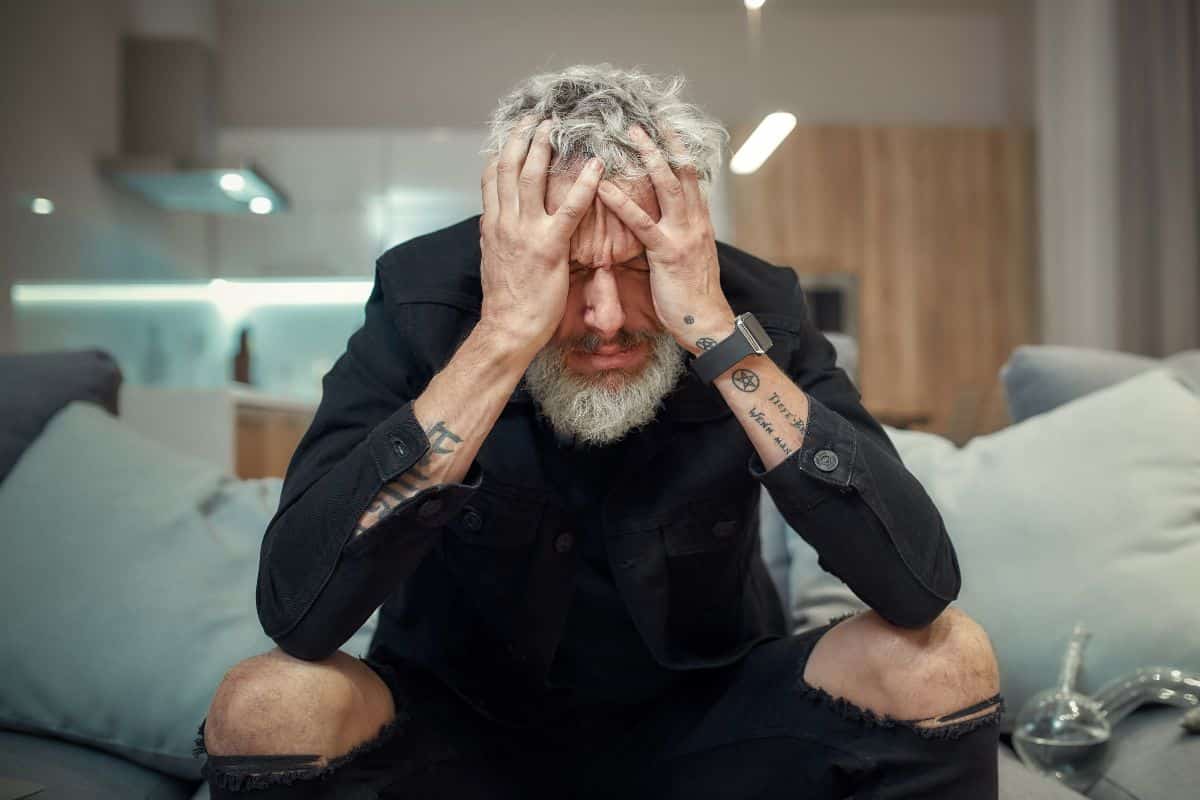A man having headache after vaping