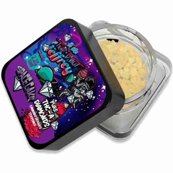 A colorful metal tin containing yellow bath salts, with a vibrant lid design featuring graphic illustrations and text