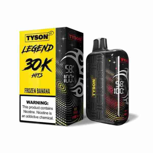 A Tyson 2.0 Legend 30000 Hits Nicotine Vape in Frozen Banana is displayed beside its box featuring bold text and a nicotine warning. The device’s front displays digital indicators.